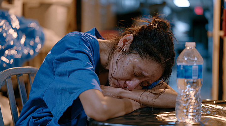 Healthcare worker sleeping at table