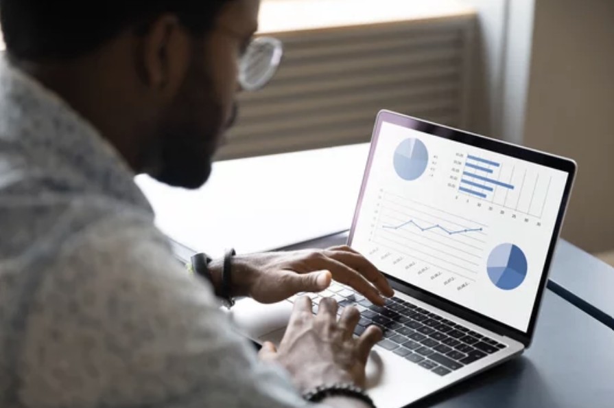 A social worker uses data visualization software to analyze program effectiveness.