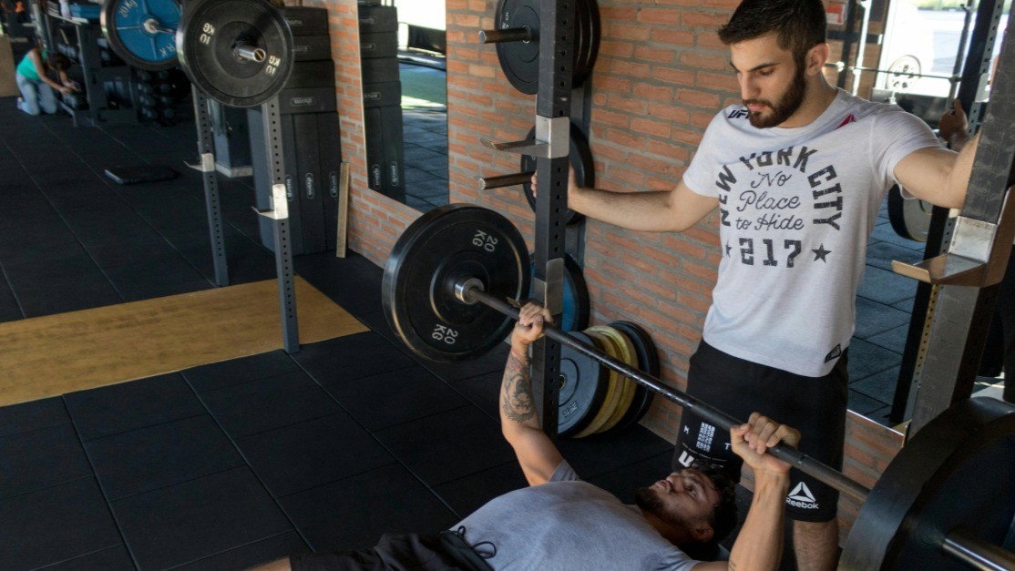 weightlifting with trainer